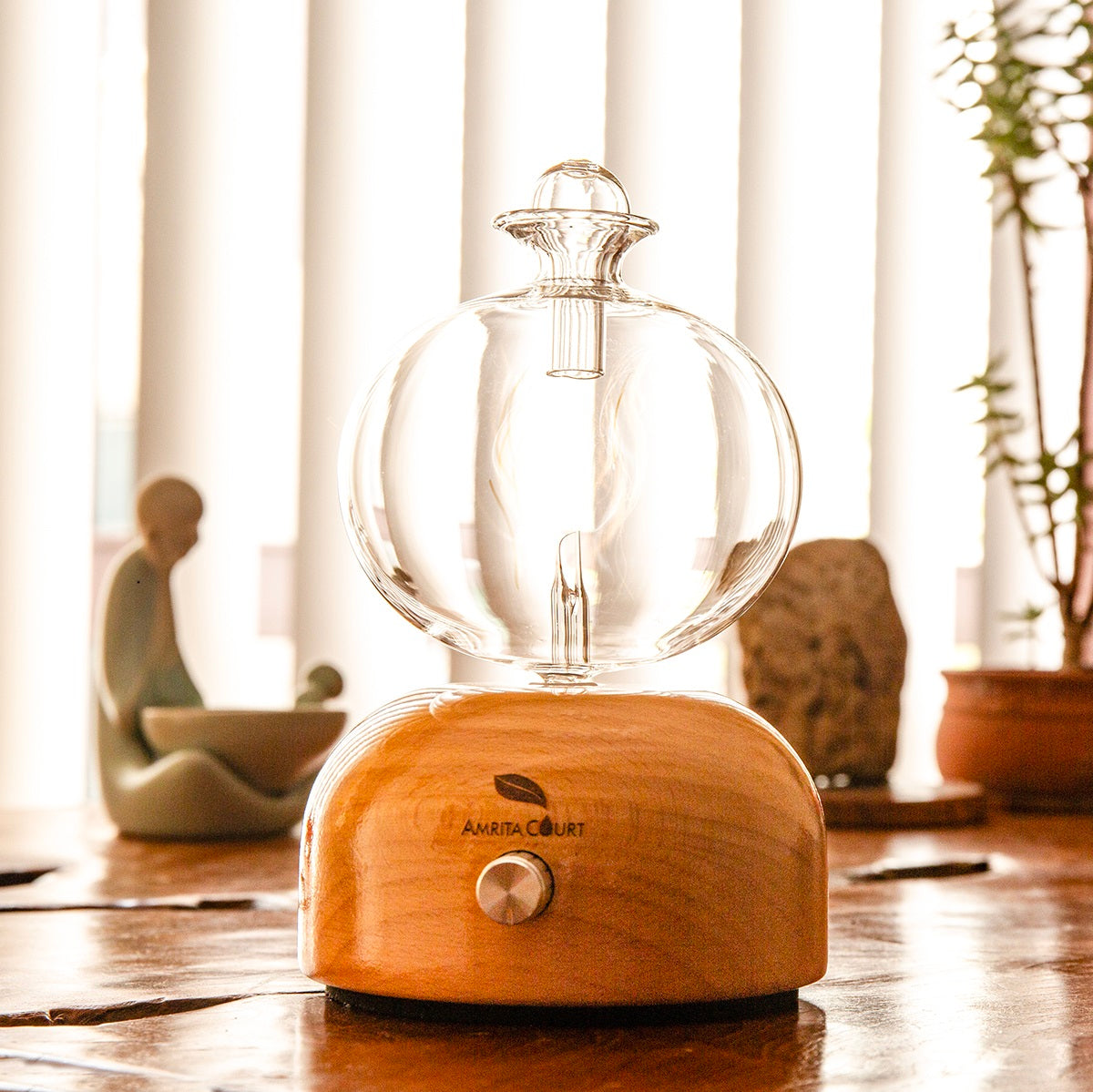 Oscar High Waterless Essential Oil Diffuser with hand-blown glass and natural wood base.